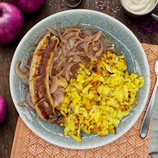 Saucisse à rôtir avec sauce aux oignons & rösti
